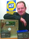 John Cave, national procurement manager for ADT Security, shows the new gel technology battery